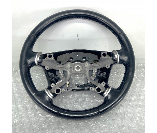 LEATHER STEERING WHEEL FOR A MITSUBISHI PAJERO - V98W