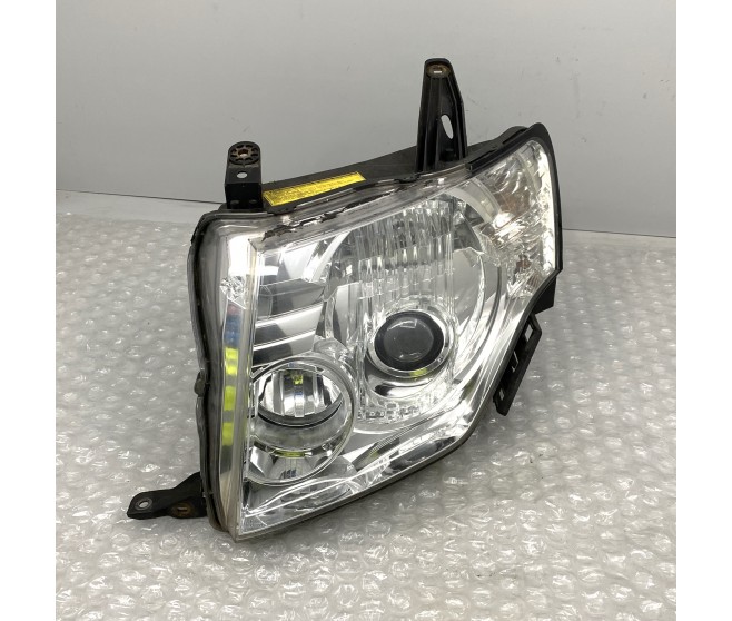 LEFT HEADLAMP FOR A MITSUBISHI PAJERO - V87W