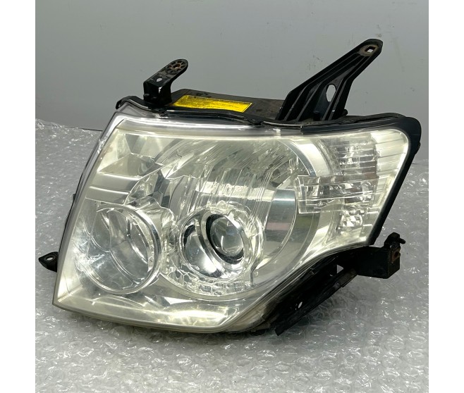 LEFT HEADLAMP FOR A MITSUBISHI PAJERO/MONTERO - V88W