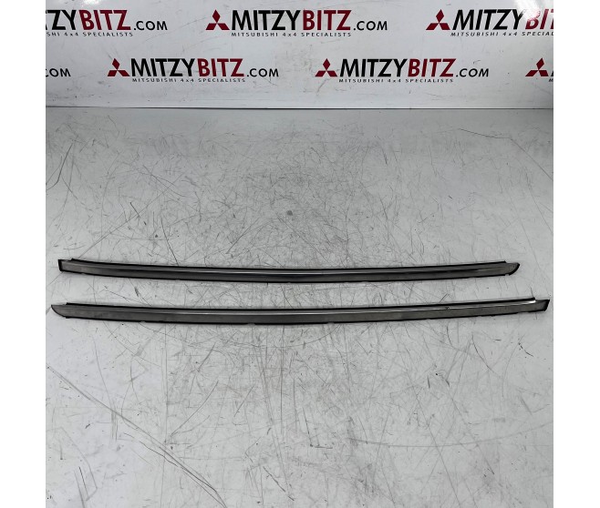 RIGHT AND LEFT WINDSHIELD SIDE MOULDINGS FOR A MITSUBISHI V30,40# - WINDSHIELD GLASS & MOULDING