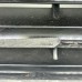 DAMAGED RADIATOR GRILLE FOR A MITSUBISHI V10-40# - RADIATOR GRILLE,HEADLAMP BEZEL