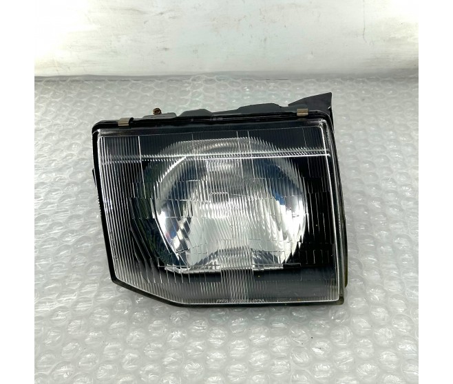 FRONT RIGHT HEADLIGHT FOR A MITSUBISHI V20,40# - FRONT RIGHT HEADLIGHT