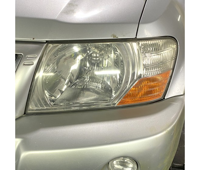 FRONT LEFT HEADLAMP FOR A MITSUBISHI PAJERO/MONTERO - V78W