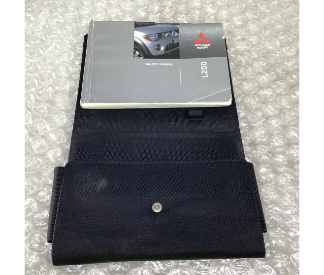 OWNERS HANDBOOK WITH WALLET FOR A MITSUBISHI KA,B0# - PLATE & LABEL