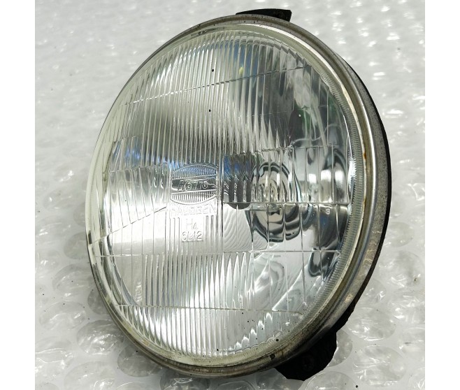 KOITO ROUND HEADLAMP FOR A MITSUBISHI PAJERO - V24W