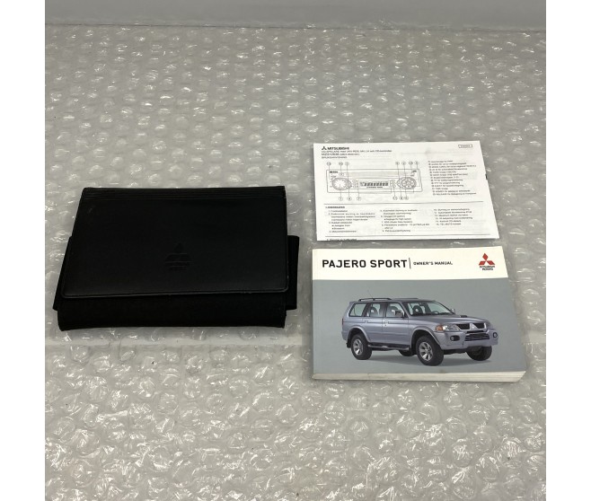 OWNERS HANDBOOK WOTH WALLET FOR A MITSUBISHI PAJERO/MONTERO SPORT - K96W