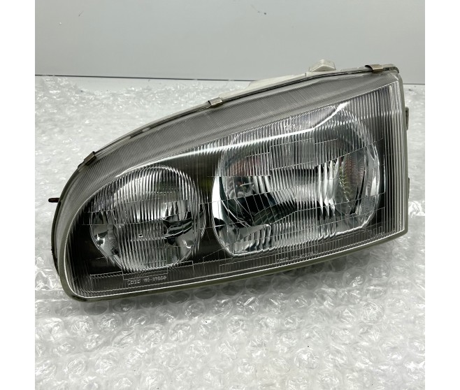 FRONT LEFT HEADLIGHT FOR A MITSUBISHI DELICA SPACE GEAR/CARGO - PD6W