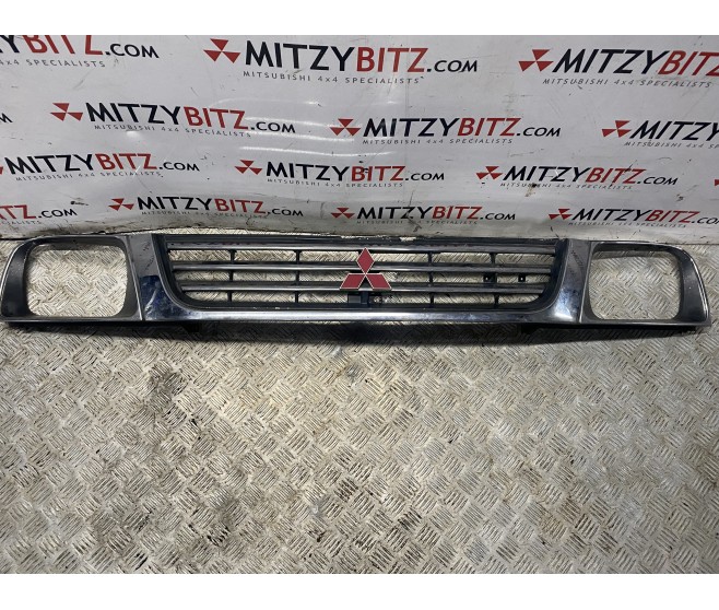 RADIATOR GRILLE FOR A MITSUBISHI L200 - K75T