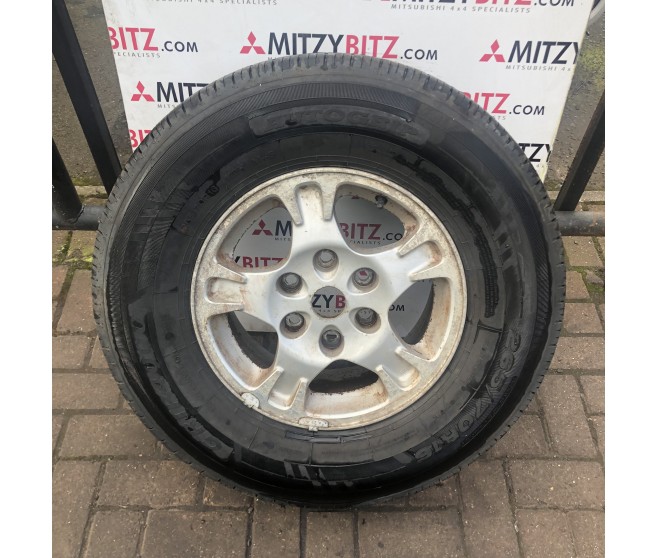 ALLOY WHEEL AND TYRE 16 FOR A MITSUBISHI PAJERO - V93W