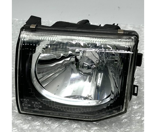 FRONT LEFT HEADLAMP CLEAR LENS FOR A MITSUBISHI PAJERO/MONTERO - V23W