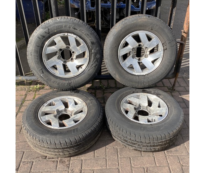 ALLOY WHEEL SET AND PART WORN TYRES - SEE DESC