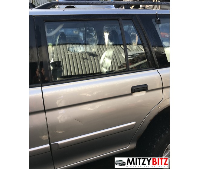 REAR LEFT SILVER BARE DOOR PANEL ONLY FOR A MITSUBISHI MONTERO SPORT - K89W