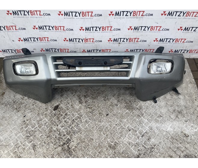 SILVER FRONT BUMPER WITH WASHER JETS  FOR A MITSUBISHI PAJERO/MONTERO - V65W
