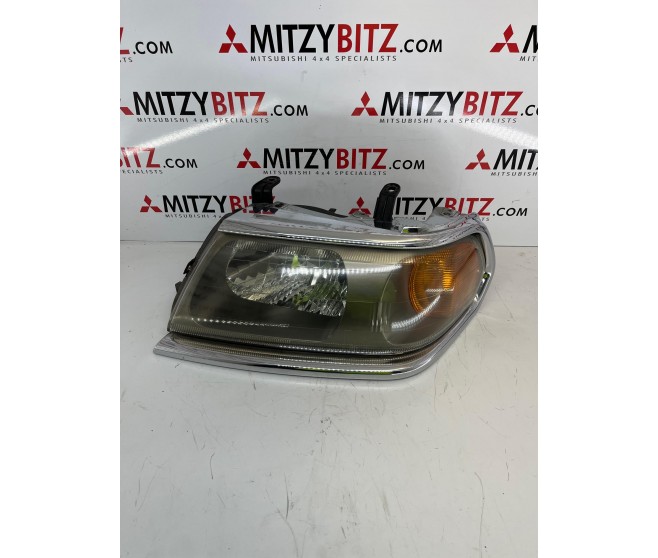 LEFT FRONT HEADLAMP FOR A MITSUBISHI PAJERO/MONTERO SPORT - K94W