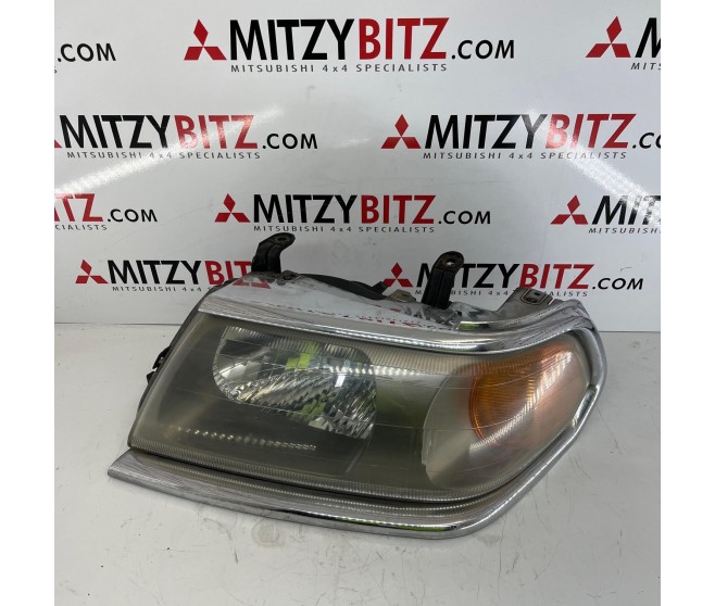 LEFT FRONT HEADLAMP FOR A MITSUBISHI PAJERO/MONTERO SPORT - K94W