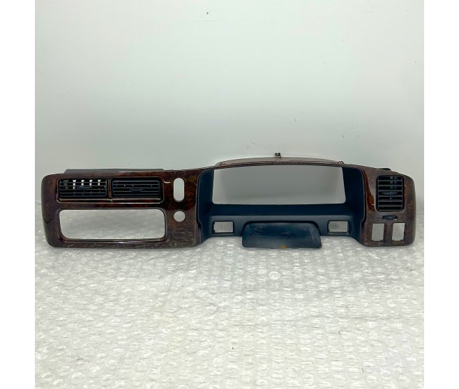 WOOD EFFECT CENTRE DASH PANEL TRIM FOR A MITSUBISHI PAJERO/MONTERO SPORT - K94W